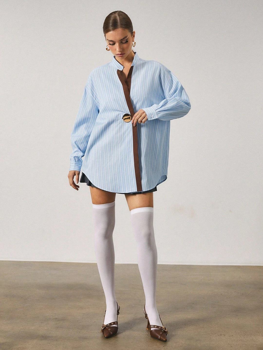 Chemise longue à rayures avec fermeture en métal