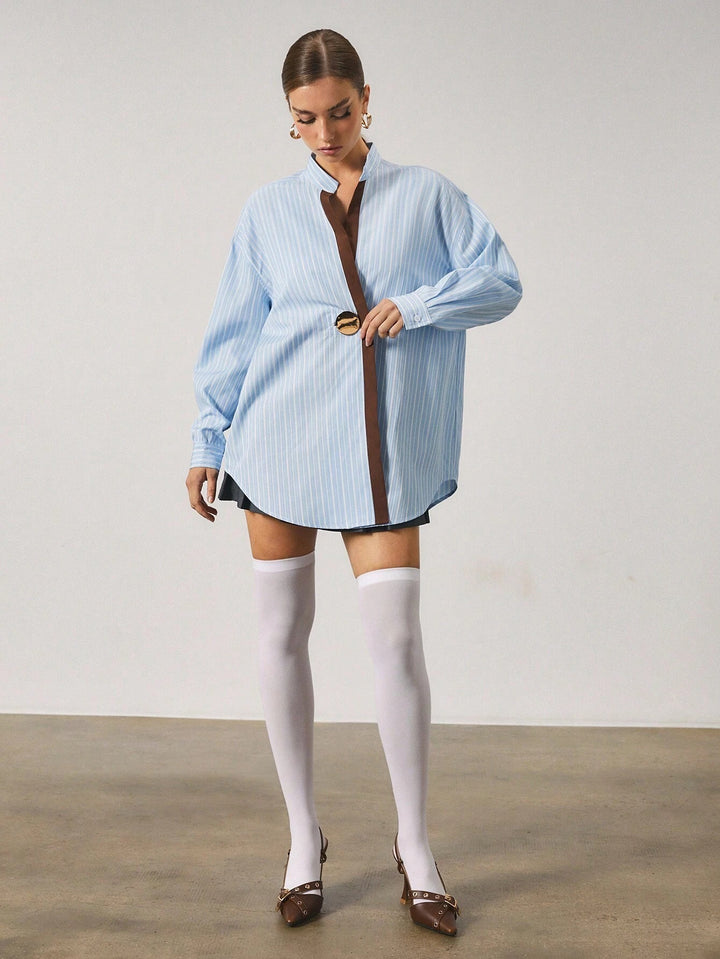 Chemise longue à rayures avec fermeture en métal