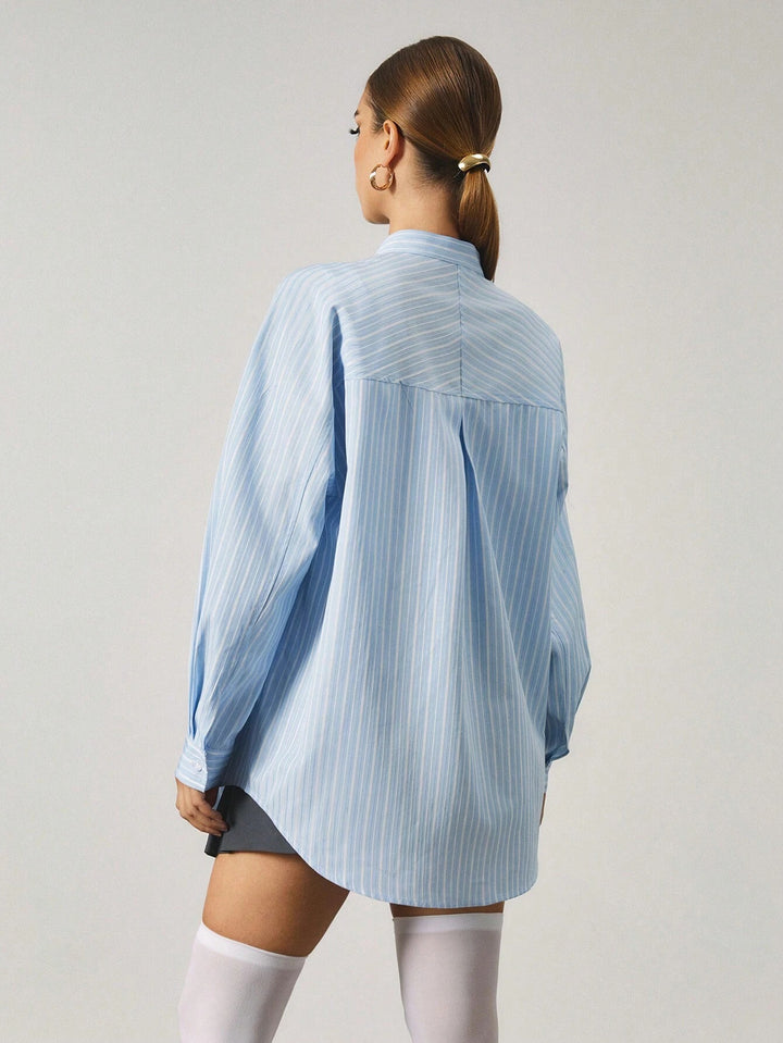Chemise longue à rayures avec fermeture en métal