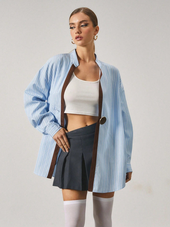 Chemise longue à rayures avec fermeture en métal