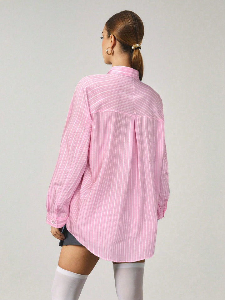 Chemise longue à rayures avec fermeture en métal