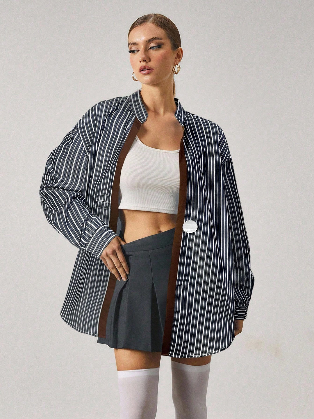 Chemise longue à rayures avec fermeture en métal