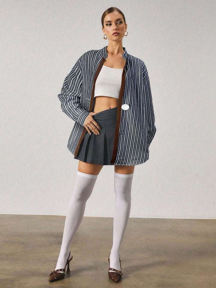 Chemise longue à rayures avec fermeture en métal