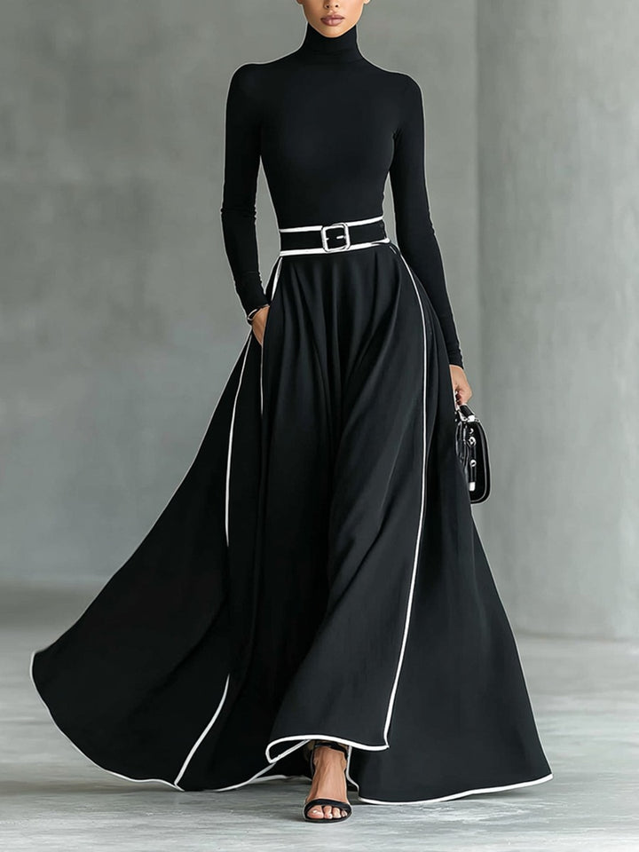 Robe longue noire col montant manches longues ceinturée avec surpiqûres