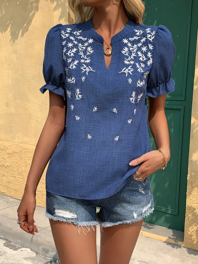 Haut élégant à broderie florale et encolure en V échancrée
