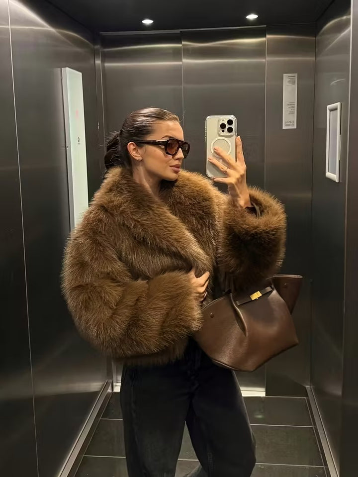 Manteau élégant en fausse fourrure