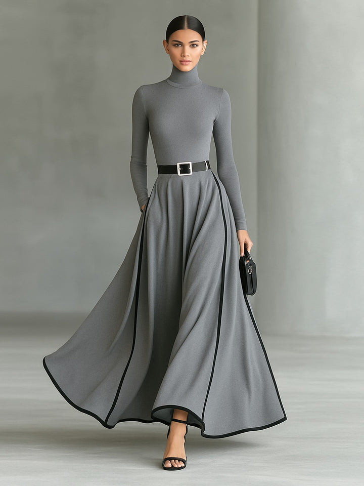 Robe longue noire col montant manches longues ceinturée avec surpiqûres