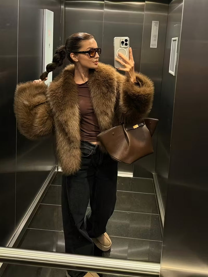 Manteau élégant en fausse fourrure