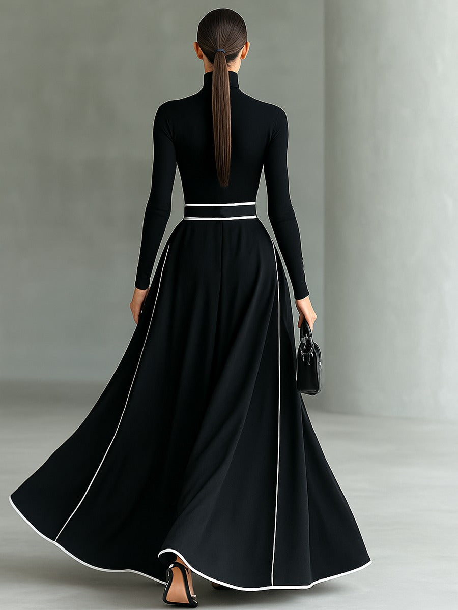 Robe longue noire col montant manches longues ceinturée avec surpiqûres