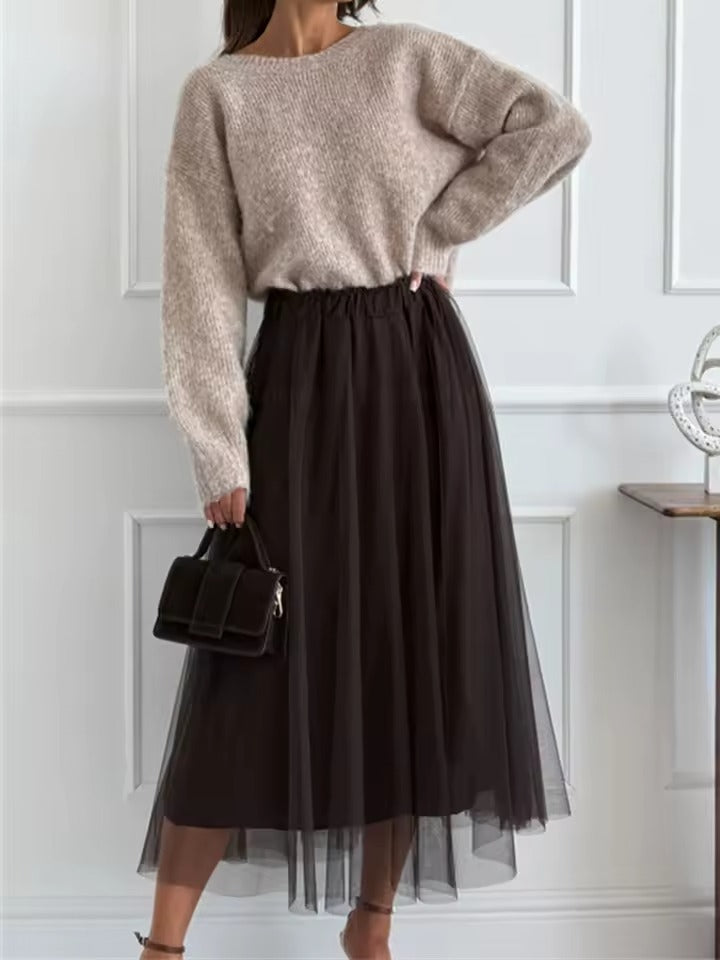 Pull à nœud et jupe fluide