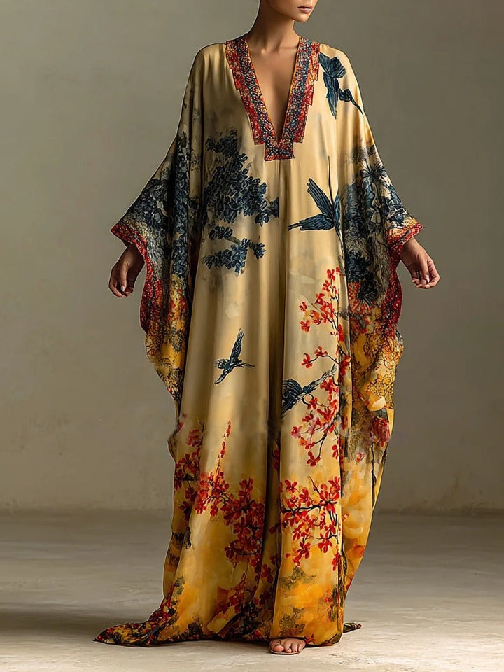 Robe à manches chauve-souris imprimée de fleurs et d'oiseaux